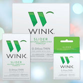 Three boxes of Okamoto Wink Slider Condoms are on display, each featuring white packaging with green accents. The product promotes itself as the thinnest condom, boasting a natural lubricated formula and highlighting an impressive 0.04mm thickness for ultimate comfort and protection.